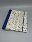Preview: Ringbuch Planer A5 blau beige Blumen Gummiband Front